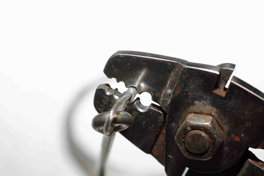 Leave 1-2mm from the end when crimping. This will flair out the end so not to damage the wire or nylon. © Jarrod Day